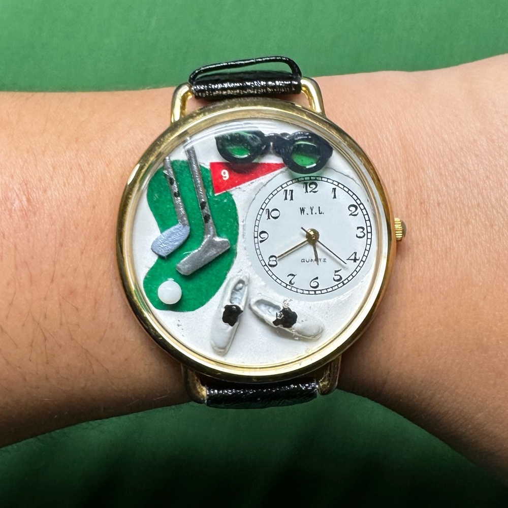 Fun golf watch with black band. Stainless steel